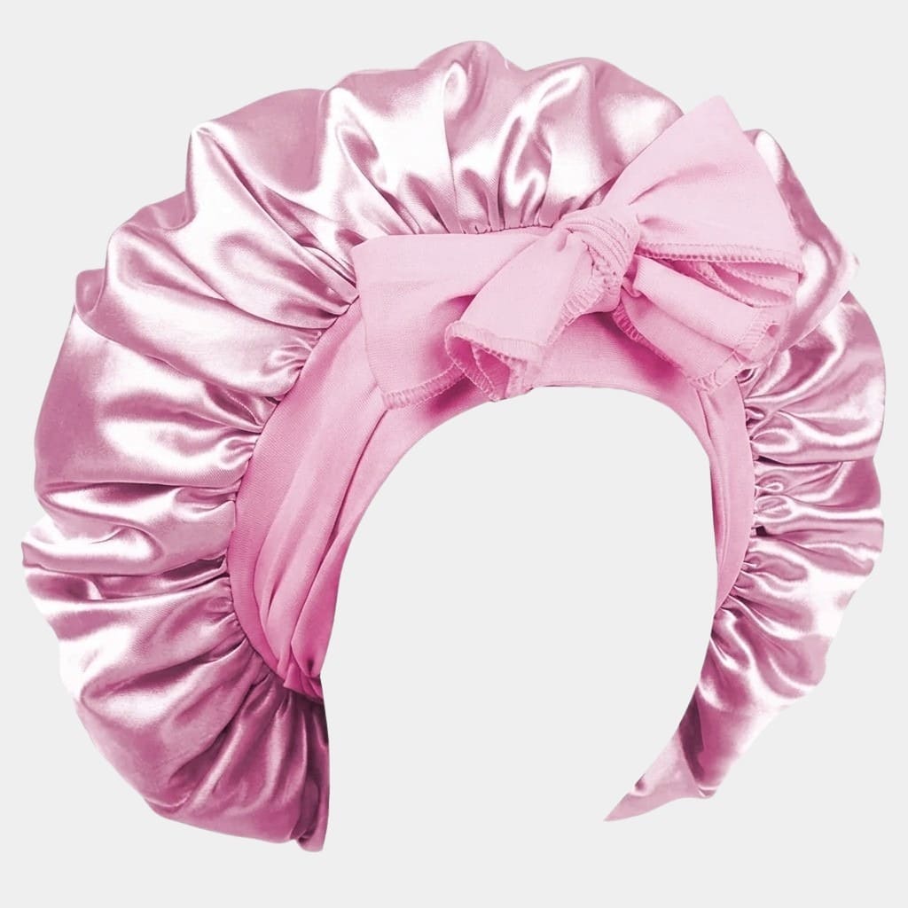 Bonnet de nuit en satin rose clair avec nœud ajustable