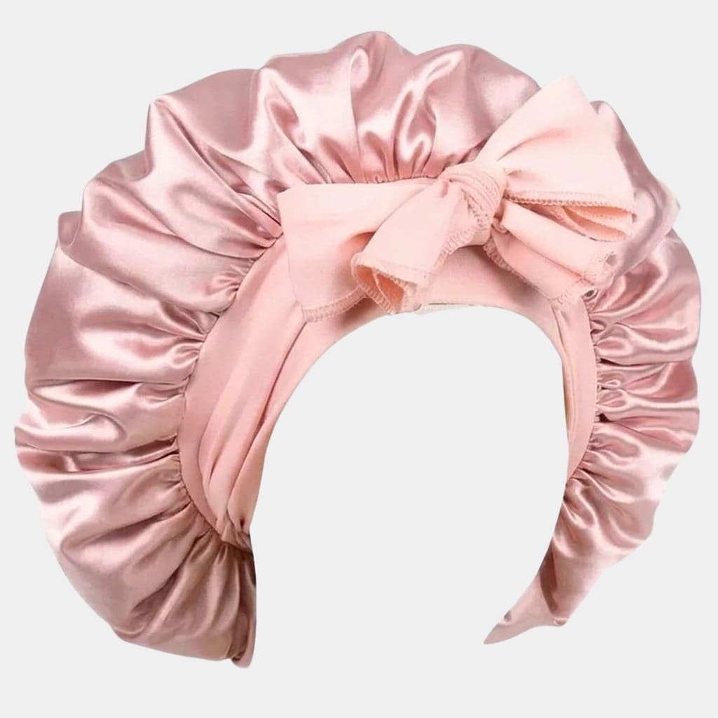 Bonnet de nuit en satin rose pâle avec nœud ajustable
